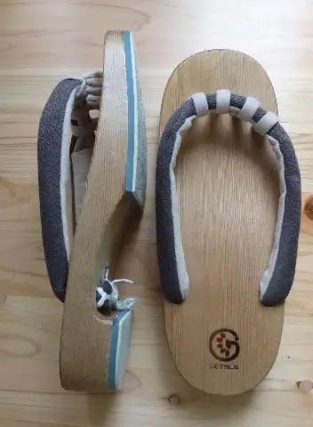 specially designed wooded clogs. four clog thongs between toes help to soften stiffed terminal joints on your feet