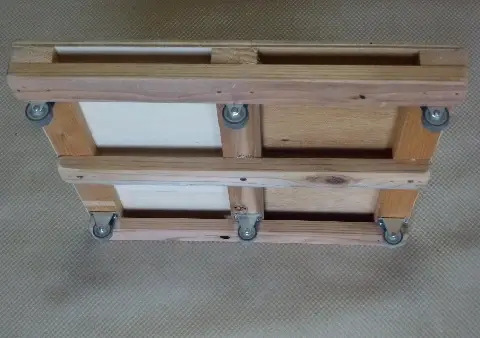 a sliding seat with door rollers made from waste wood