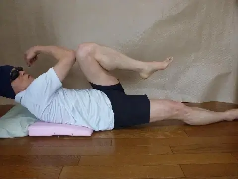 twist your body by hitting your right elbow and left knee